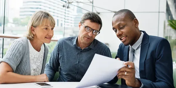 Three people having a meeting